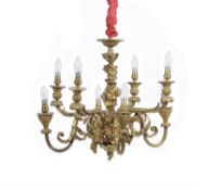 A French gilt metal eight light chandelier in Louis XVI style