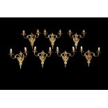 A set of seven French gilt bronze wall appliques in Louis XVI style