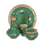 A French porcelain green-ground and gilt solitaire absinthe service painted with flowers