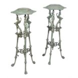 A pair of French cast iron and green enamel low torcheres in early 19th Century style