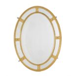 A carved giltwood oval marginal wall mirror