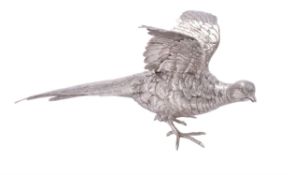 A silver model of an alarmed pheasant