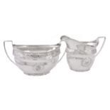 A George III silver oval sugar basin and cream jug