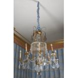 A Continental gilt metal and cut and moulded glass eight light chandelier