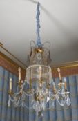 A Continental gilt metal and cut and moulded glass eight light chandelier