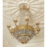 A gilt metal and glass eight light chandelier