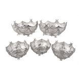 A suite of five Victorian silver shaped circular dessert baskets by Robert Harper