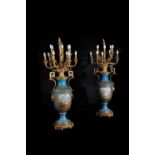 A substantial pair of Sevres-style porcelain gilt-metal-mounted floor vases fitted as lamps