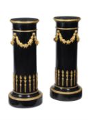 A pair of French ebonised and gilt bronze mounted pedestals
