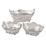 A matched suite of three Edwardian silver oval dessert baskets