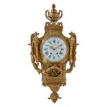 A Louis XVI style gilt brass cartel clock