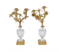 A pair of gilt metal and cut glass two light candelabra