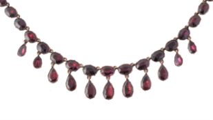 A Georgian gold and flat cut garnet fringe necklace