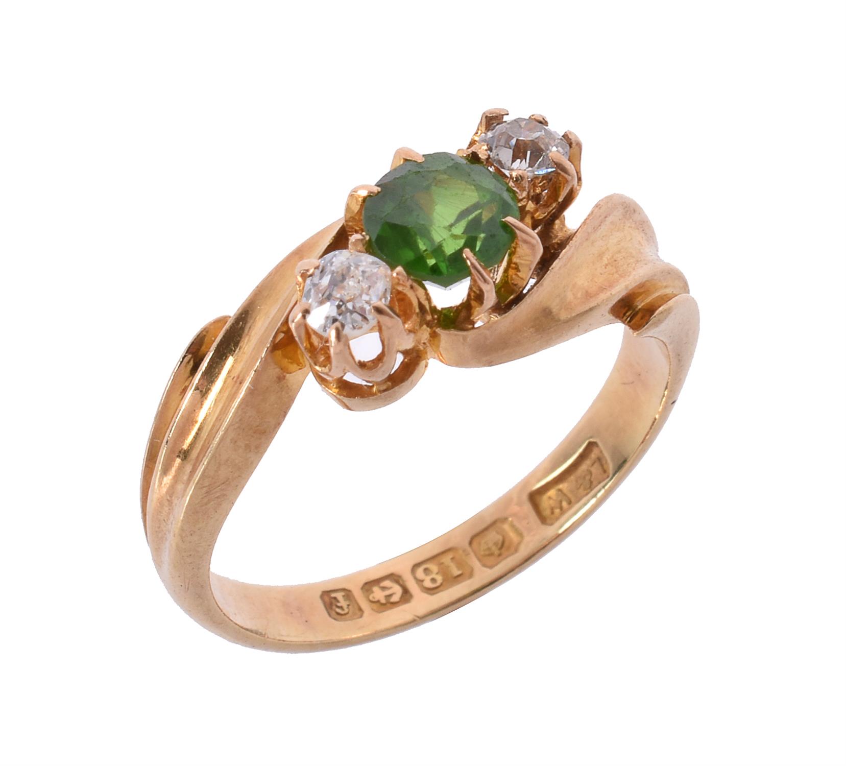 An Edwardian 18 carat gold demantoid garnet and diamond ring