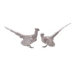 A matched pair of silver models of pheasants