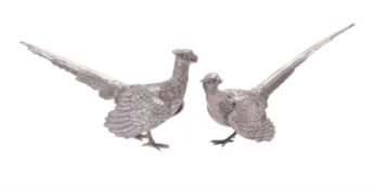 A matched pair of silver models of pheasants