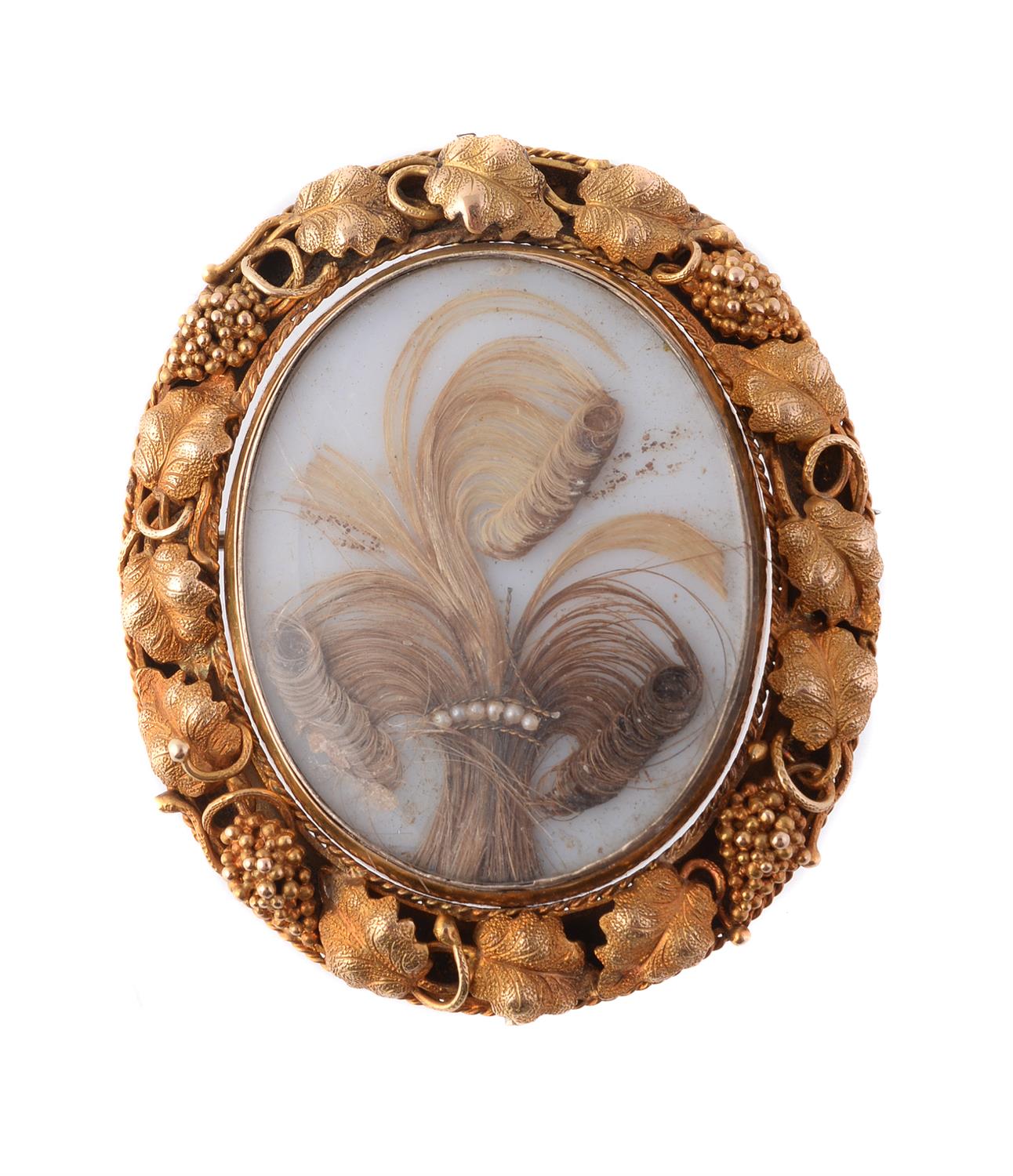 An early Victorian gold and hair work brooch