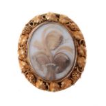 An early Victorian gold and hair work brooch