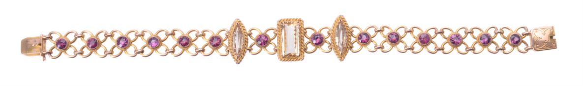 A late Victorian rhodolite garnet and topaz bracelet