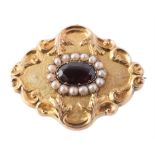 A mid Victorian gold, garnet and half pearl brooch