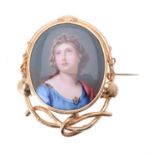 A mid 19th century painted porcelain brooch