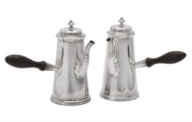 A pair of late Victorian silver tapering coffee pots by Charles Stuart Harris