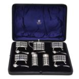 A cased seven piece cruet set by Haseler Brothers