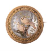 A mid Victorian reverse painted intaglio brooch