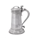 A Queen Anne Britannia standard silver slightly tapering wine flagon by Timothy Ley