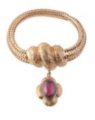 A late Victorian gold and garnet bracelet