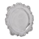 An Edwardian silver shaped circular salver by James Dixon & Sons Ltd.