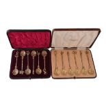 Two cased sets of six silver and silver gilt coloured tea spoons