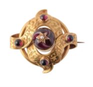 A mid Victorian gold and garnet knot brooch