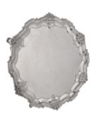 A late Victorian silver shaped circular salver by Edward Barnard & Sons Ltd