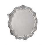 A late Victorian silver shaped circular salver by Edward Barnard & Sons Ltd