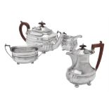 A silver four piece oblong baluster tea set by Adie Bros.