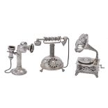 An Italian silver coloured miniature model of a gramophone and two telephones