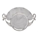 A Middle Eastern silver coloured twin handled tray