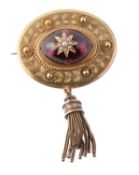 A late Victorian gold and garnet brooch