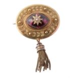 A late Victorian gold and garnet brooch
