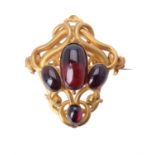 A mid Victorian gold and garnet brooch