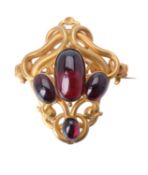 A mid Victorian gold and garnet brooch