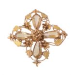 An early Victorian two colour gold and citrine cross brooch
