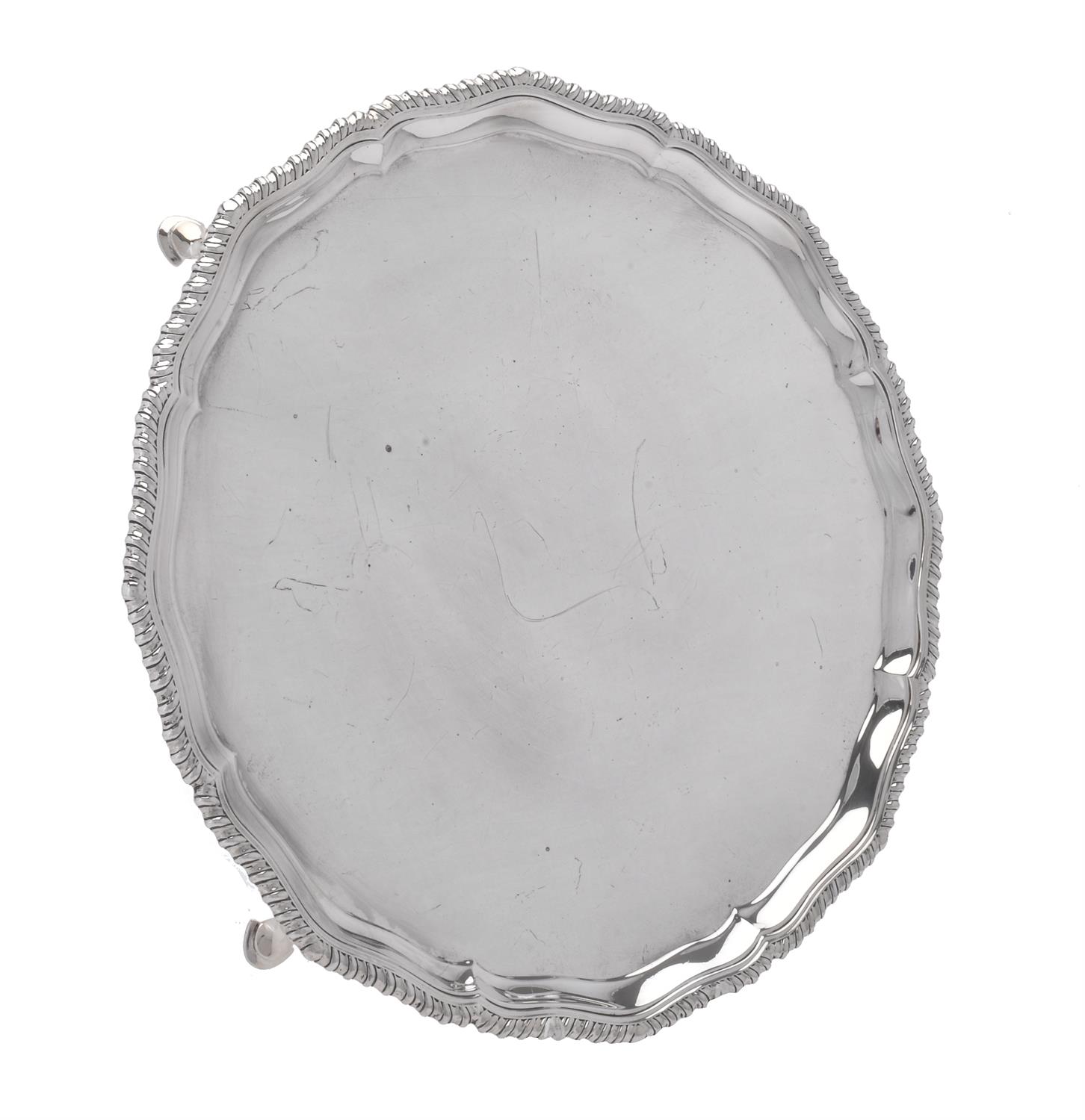 A silver shaped circular salver by Edward Barnard & Sons Ltd.