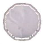 A silver shaped circular salver by Viners
