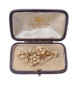 An Edwardian half pearl floral spray brooch