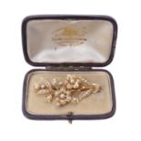 An Edwardian half pearl floral spray brooch