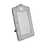 A silver mounted shaped rectangular mirror