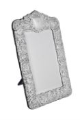A silver mounted shaped rectangular mirror