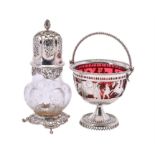 An Edwardian silver mounted clear glass sugar caster by William Comyns & Sons